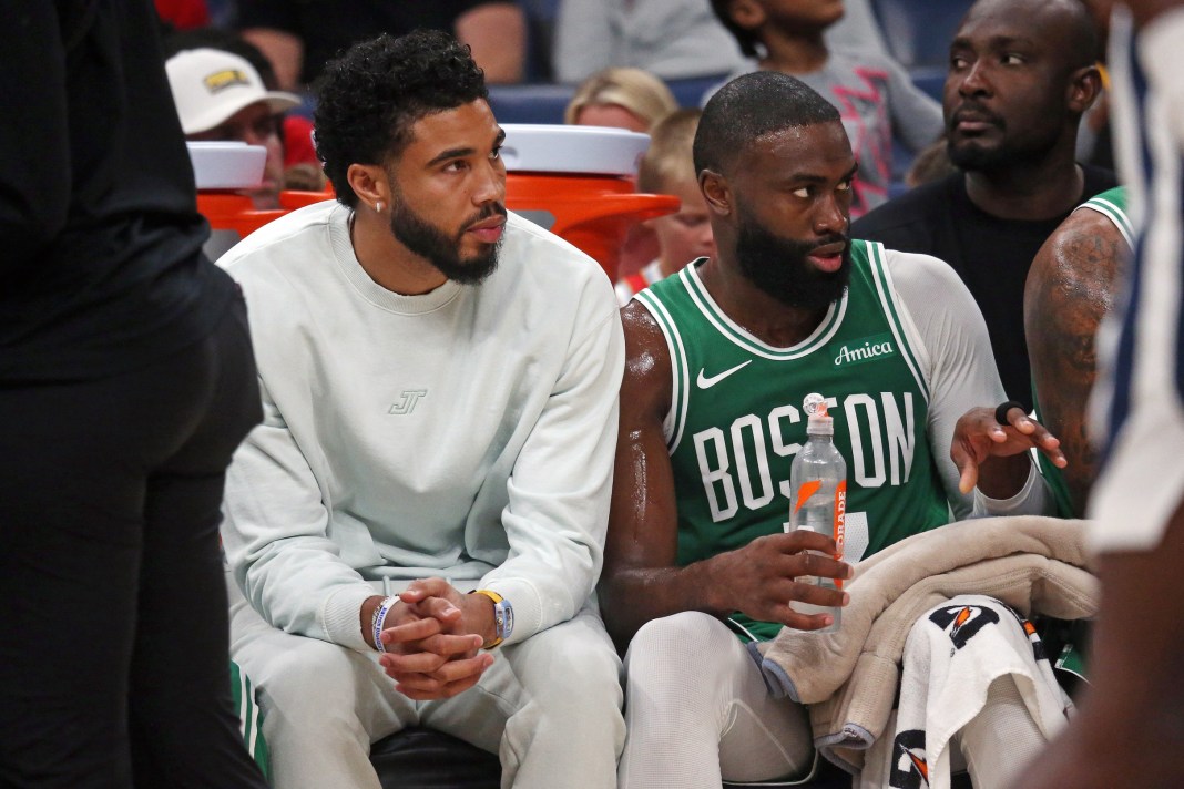 Celtics star Jaylen Browns sits next to an injured Jayson Tatum in the 2025-26 NBA preseason.
