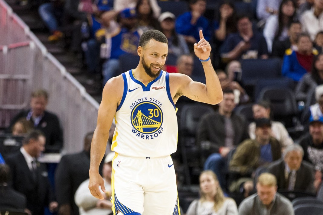 Warriors superstar Stephen Curry gestures during a preseason game against the Blazers during the 2025-26 season.