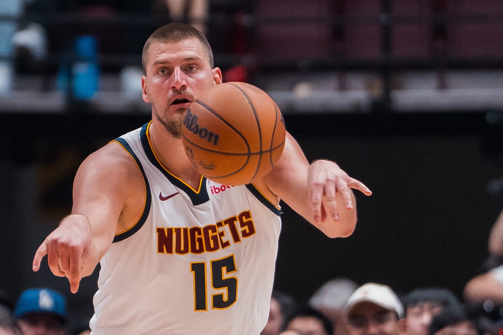 Nuggets superstar Nikola Jokic passes against the Raptors during the 2025-26 NBA preseason.