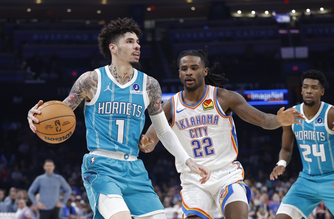 Hornets star LaMelo Ball drives to the basket against the Thunder during the 2025-26 NBA preseason.
