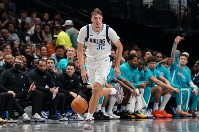 Mavericks rookie Cooper Flagg bring the ball up against the Hornets during the 2025-26 NBA preseason.
