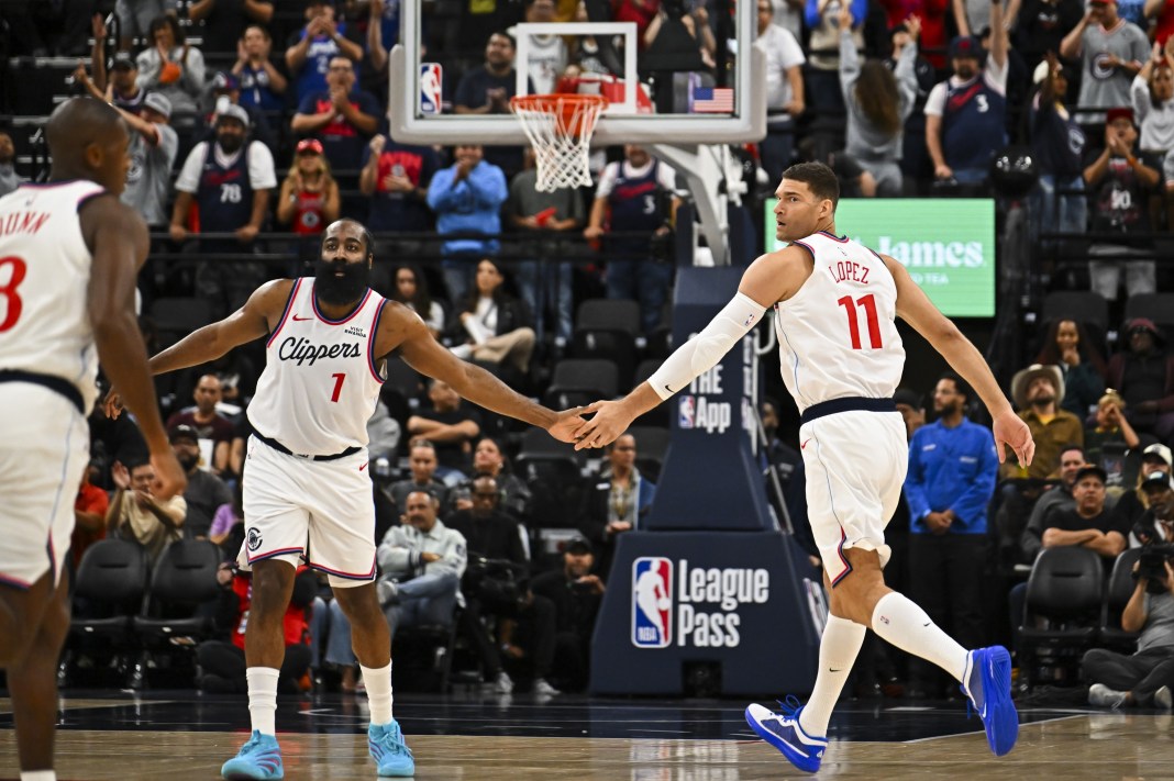 Clippers star James Harden high fives Brook Lopez during the 2025-26 NBA preseason.
