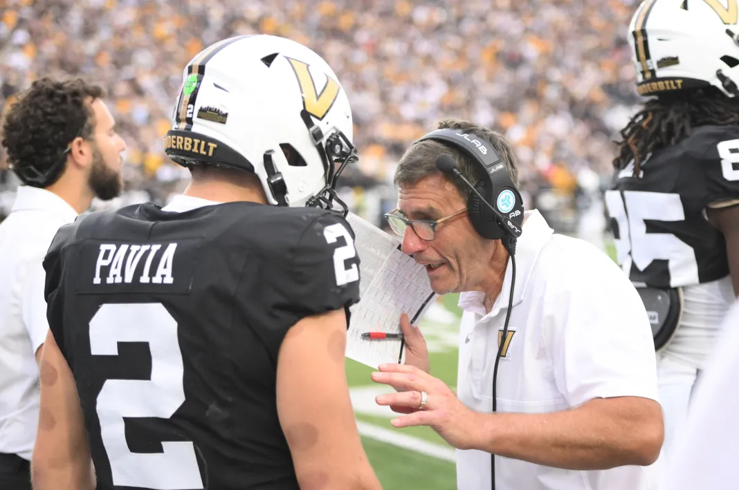 NCAA Football: Missouri at Vanderbilt Vanderbilt quarterback Diego Pavia talks to his assistant coach during a game against Missouri in the 2025 college football season.