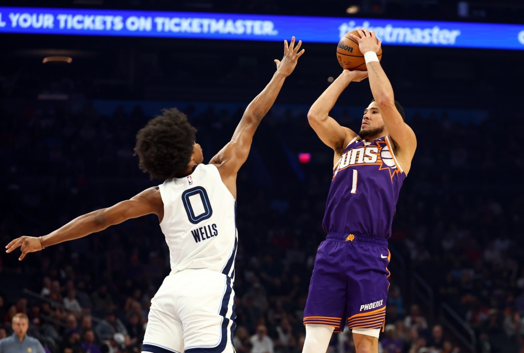 Suns star Devin Booker takes a jumper against the Grizzlies during the 2025-26 NBA season.