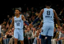 NBA Picks & Predictions Today (Nov. 3): Best Bets on Sides & Totals Grizzlies stars Ja Morant and Jaren Jackson Jr. high five against the Lakers during the 2025-26 NBA season.