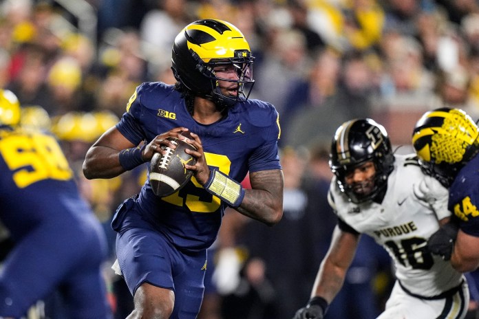 Michigan quarterback Bryce Underwood looks to throw against Purdue during the 2025 college football season.