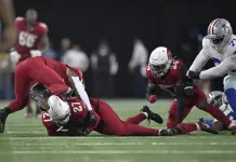 Cowboys Upset by Cardinals on MNF After Jerry Jones’ “Big Deal” Tease Arizona Cardinals linebacker Akeem Davis-Gaither (27) recovers a fumble.