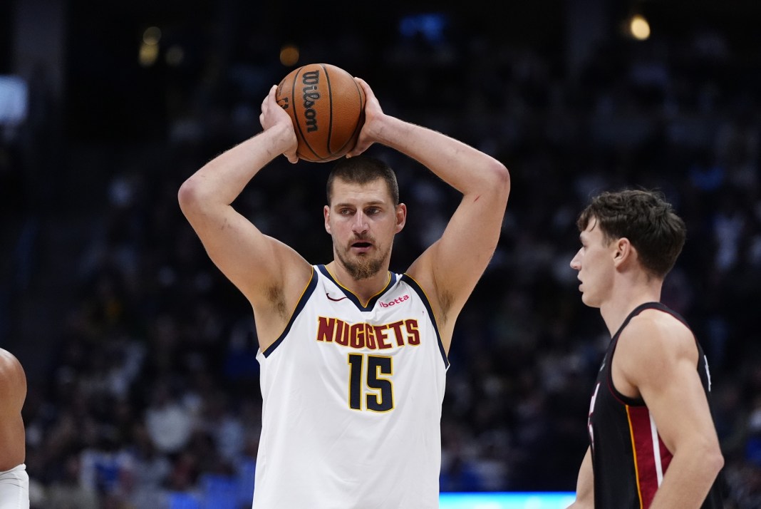 NBA: Miami Heat at Denver Nuggets Nuggets superstar Nikola Jokic looks to pass against the Heat during the 2025-26 NBA season.