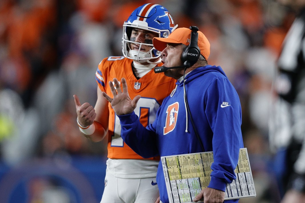 Broncos quarterback Bo Nix talks to head coach Sean Payton during a meeting with the Raiders in the 2025 NFL season.
