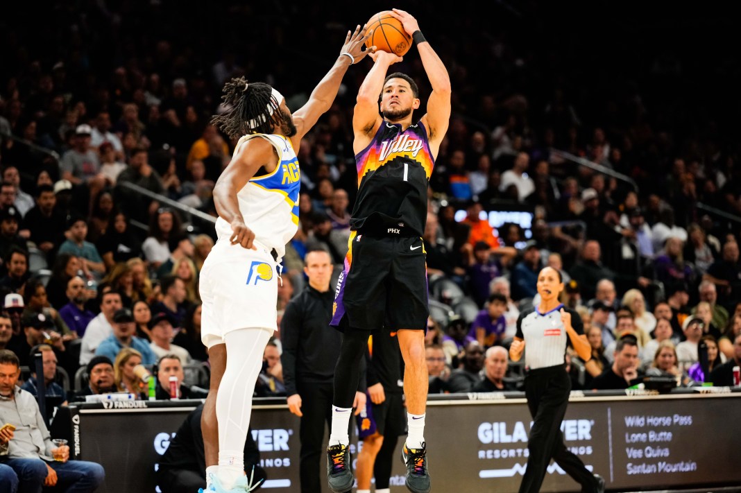 Suns superstar Devin Booker takes a shot against the Pacers during the 2025-26 NBA season.