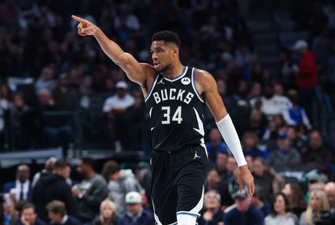 Bucks superstar Giannis Antetokounmpo points against the Mavericks during the 2025-26 NBA season.