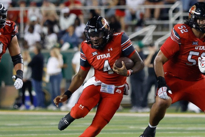 Utah quarterback Devon Dampier runs against Baylor during the 2025 college football season.