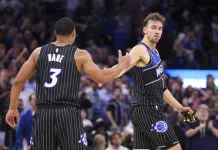 NBA Picks & Predictions Today (Dec. 5): Best Bets on Sides & Totals Magic stars Franz Wagner and Desmond Bane high five during a game against the Spurs in the 2025-26 NBA season.