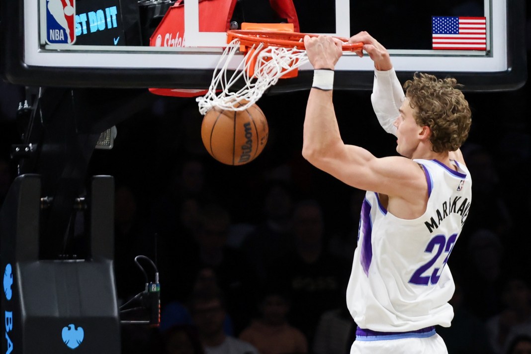Jazz star Lauri Markkanen dunks against the Nets during the 2025-26 NBA season.