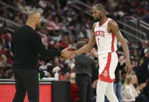 NBA Picks & Predictions Today (Dec. 11): Best Bets on Sides & Totals Rockets star Kevin Durant high fives coach Ime Udoka during a meeting with the Suns in the 2025-26 NBA season.