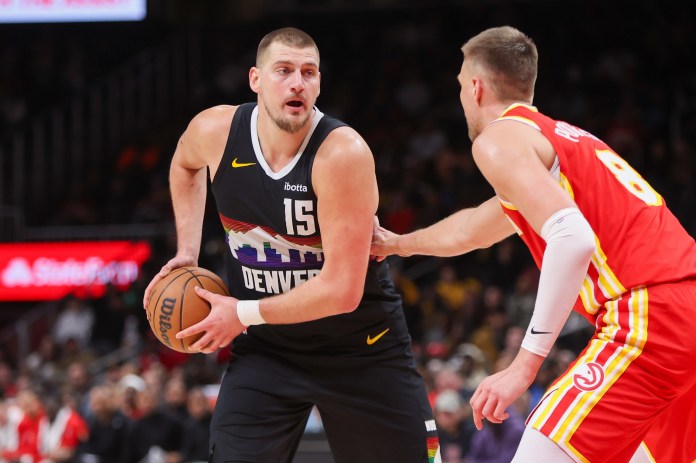 Nuggets star Nikola Jokic looks to make a play against the Hawks during the 2025-26 NBA season.
