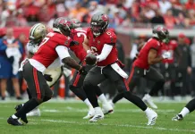 Falcons vs. Buccaneers Predictions: Week 15 Thursday Night Football odds, picks and player props Buccaneers quarterback Baker Mayfield hands the ball to Bucky Irving in a meeting with the Saints during the 2025 NFL season.