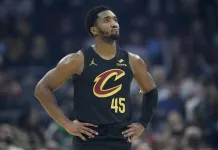 NBA Picks & Predictions Today (Dec. 22): Best Bets on Sides & Totals Cavaliers star Donovan Mitchell looks on against the Hornets during the 2025-26 NBA season.