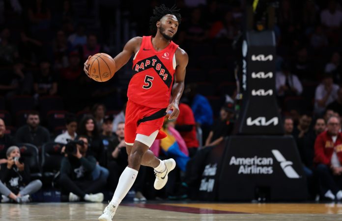 Raptors guard Immanuel Quickley brings the ball up against the Heat during the 2025-26 NBA season.