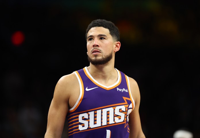 Suns superstar Devin Booker looks on against the Warriors during the 2025-26 NBA season.