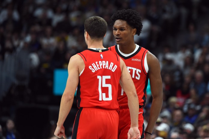 Rockets players Amen Thompson and Reed Sheppard celebrate a play against the Nuggets during the 2025-26 NBA season.
