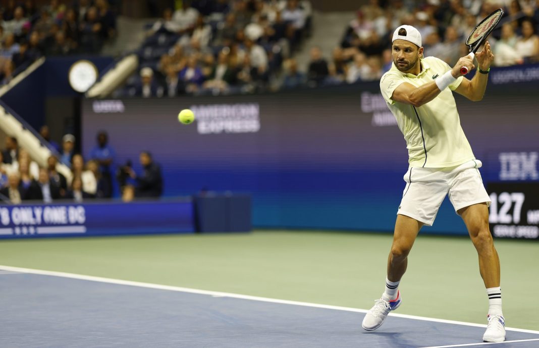 Grigor Dimitrov looks to hit a backhand against Frances Tiafoe at the 2024 US Open.