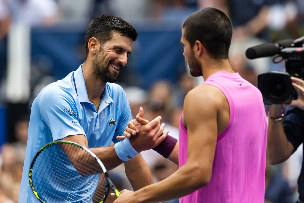 Tennis: US Open Novak Djokovic and Carlos Alcaraz meet at the net at the 2025 US Open.