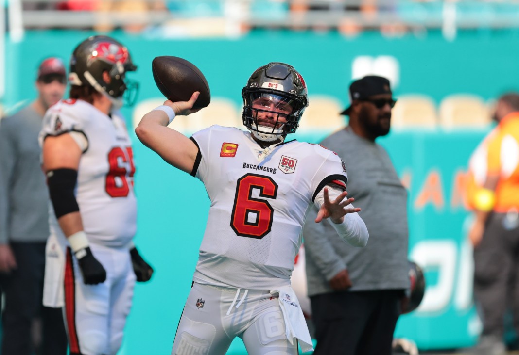 Buccaneers star Baker Mayfield warms up against the Dolphins during the 2025 NFL season.