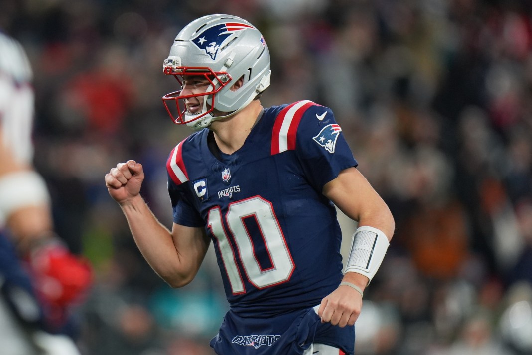 Patriots star Drake Maye pumps his fist against the Dolphins during the 2025 NFL season.
