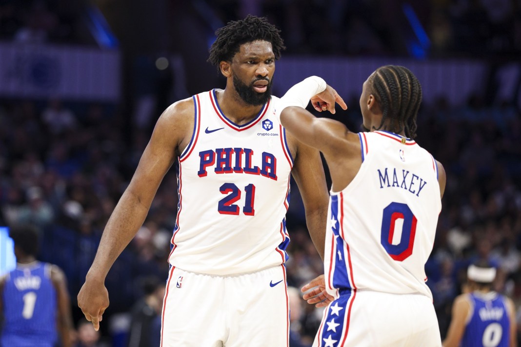 Sixers stars Joel Embiid and Tyrese Maxey react to a play against the Magic during the 2025-26 NBA season.