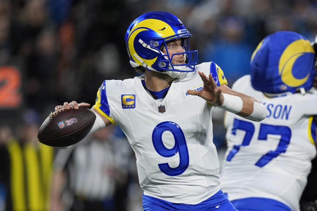 Rams superstar Matthew Stafford looks to throw against the Panthers during the NFL Playoffs.