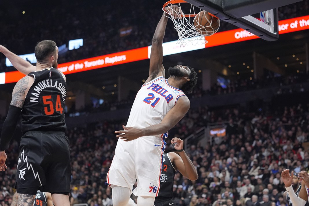 Sixers star Joel Embiid dunks against the Raptors during the 2025-26 NBA season.