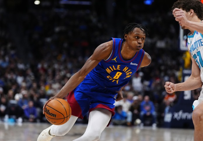 Nuggets wing Peyton Watson drives to the basket against the Hornets during the 2025-26 NBA season.