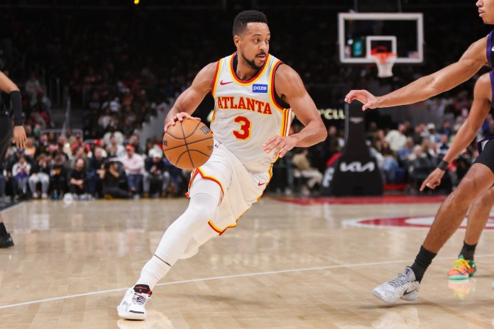 Hawks guard CJ McCollum drives against the Suns during the 2025-26 NBA season.