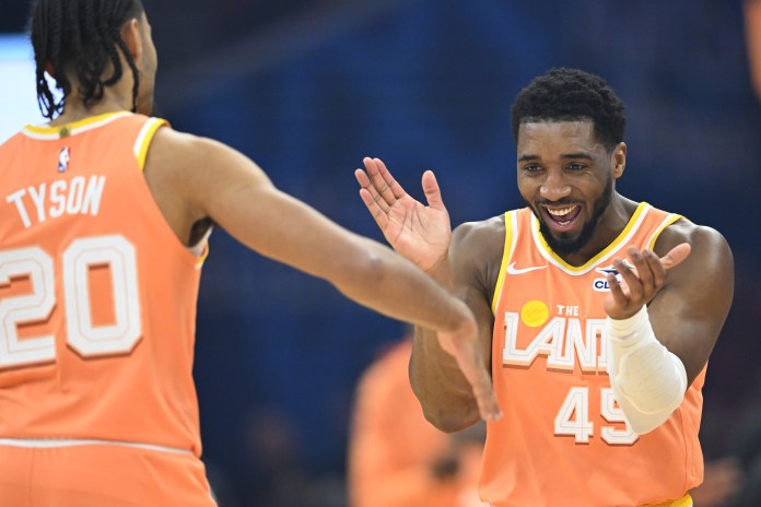 Cavaliers star Donovan Mitchell celebrates with Jaylon Tyson against the Magic during the 2025-26 NBA season.