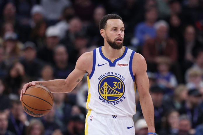 Warriors superstar Stephen Curry brings the ball up against the Jazz during the 2025-26 NBA season.