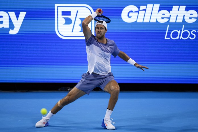 Karen Khachanov hits a forehand against Alexander Zverev during the 2025 Cincinnati Open.
