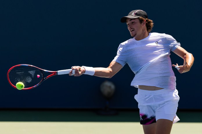 Joao Fonseca hits a forehand against Miomir Kecmanovic at the 2025 US Open.