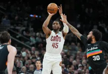 NBA All-Star Saturday Best Bets: Three Point Contest and Slam Dunk Contest predictions Cavaliers superstar Donovan Mitchell takes a shot against the Spurs during the 2025-26 NBA season.