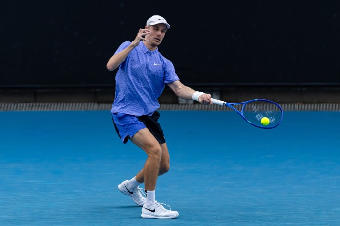 Denis Shapovalov hits a forehand against Bu Yunchaokete at the 2026 Australian Open.