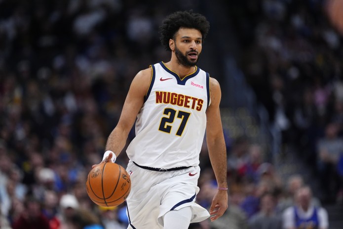 Nuggets guard Jamal Murray brings the ball up against the Nets during the 2025-26 NBA season.
