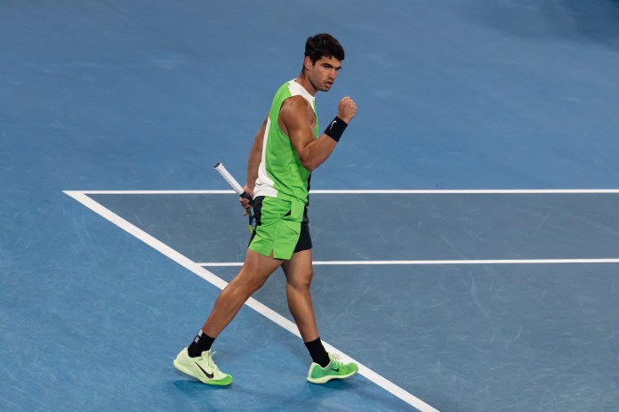 Carlos Alcaraz celebrates a point won against Novak Djokovic at the 2026 Australian Open.