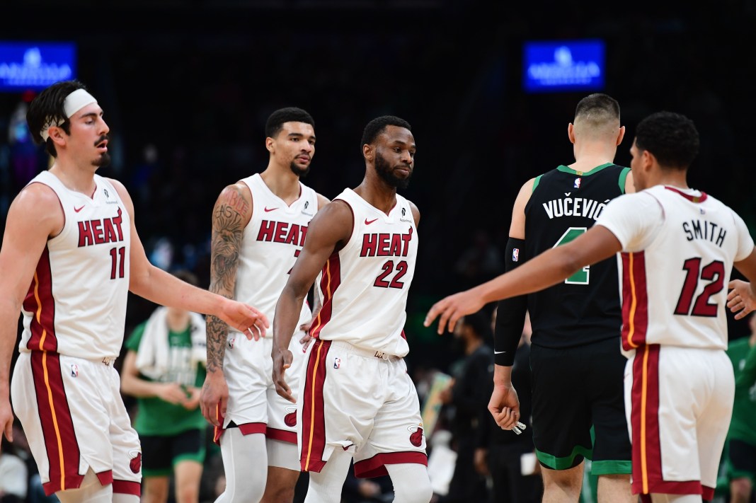 Heat forward Andrew Wiggins walks off the court with teammates against the Celtics during the 2025-26 NBA season.