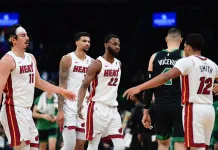 NBA Predictions Today: Best Bets and Player Props for Sunday, March 29 Heat forward Andrew Wiggins walks off the court with teammates against the Celtics during the 2025-26 NBA season.