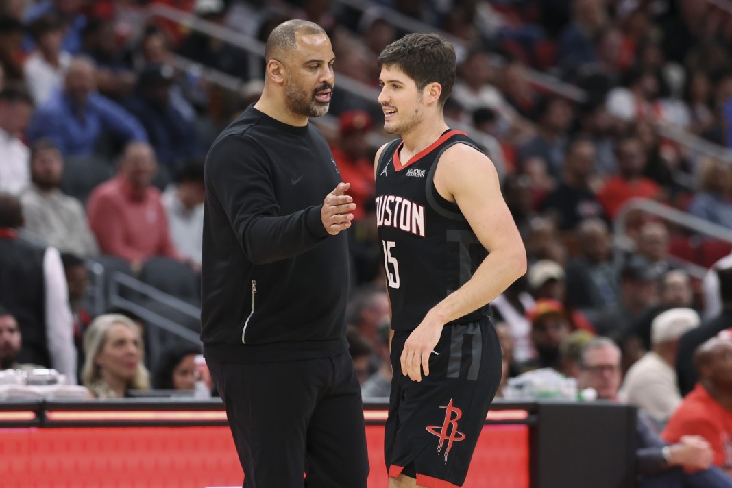 Rockets guard Reed Sheppard talks to coach Ime Udoka during the 2025-26 NBA season.