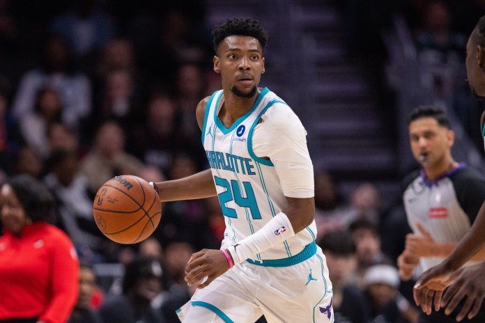 Hornets wing Brandon Miller dribbles against the Trail Blazers during the 2025-26 NBA season.