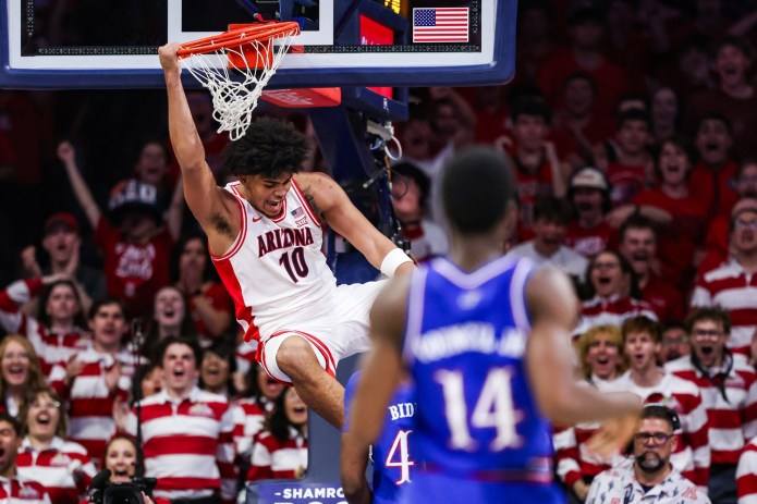Arizona freshman Koa Peat dunks against Kansas during the 2025-26 college basketball season.