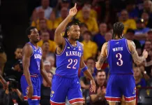 Kansas vs. Cal Baptist: NCAA Tournament East Region No. 4 vs. No 13 March Madness Preview Kansas star Darryn Peterson signals during a meeting with Arizona State in the 2025-26 college basketball season.