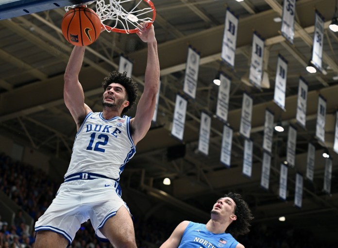 Duke superstar Cameron Boozer dunks in a meeting with North Carolina during the 2025-26 college basketball season.