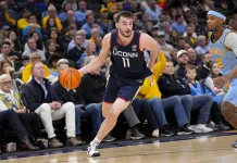 2026 Big East Conference Basketball Tournament Odds & Predictions UConn wing Alex Karaban drives against Marquette during the 2025-26 college basketball season.